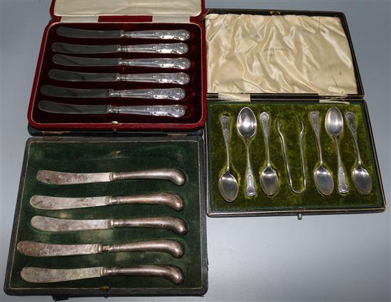 Two cases of silver handled knives & set of silver spoons